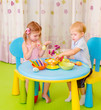 Photo: Cute children paint Easter eggs Cute children paint Easter eggs