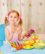 Photo: Little girl paint Easter eggs Little girl paint Easter eggs