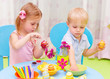 Children paint Easter eggs