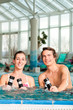 Photo: Fitness - gymnastics under water in swimming pool Fitness - gymnastics under water in swimming pool