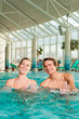 Photo: Fitness - gymnastics under water in swimming pool Fitness - gymnastics under water in swimming pool