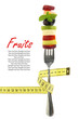 Fresh mixed slices of fruits on a fork with measuring tape
