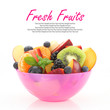 Fresh mixed fruit salad in a pink bowl