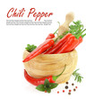 Red hot chili peppers with herbs in wooden mortar
