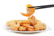 plate of fried fish on white background with chopsticks
