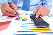 Foto: Hand with calculator. Office work. Hand with calculator. Office work.