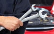 Photo: Hand with wrench. Auto mechanic. Hand with wrench. Auto mechanic.
