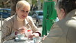 Video: Senior Female Friends Eating Dessert At Outdoor Cafe Senior Female Friends Eating Dessert At Outdoor Cafe