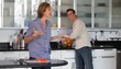 Excited Caucasian woman in kitchen