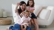Caucasian mother and girls waving