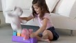 Caucasian girl playing with toys