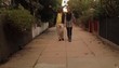 Japanese couple walking down urban alley