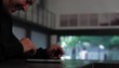 Hispanic man working at digital tablet
