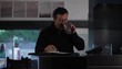 Video: Hispanic man at home using daily planner and drinking coffee Hispanic man at home using daily planner and drinking coffee