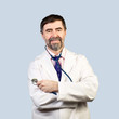 Photo: Portrait of happy middle-aged doctor with stethoscope Portrait of happy middle-aged doctor with stethoscope
