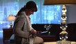 Stylish woman at home checking digital tablet