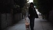 Stylish woman walking excited dog