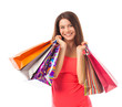 Smiling young woman holding shopping bags