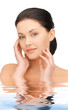 woman touching her face