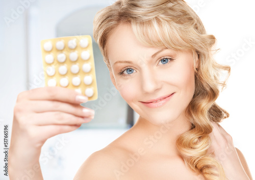 Photo: young woman with pills young woman with pills