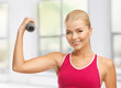 young sporty woman with light dumbbell