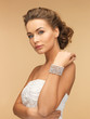 woman with pearl earrings and bracelet