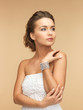woman with pearl earrings and bracelet
