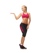 woman in sportswear with empty hand