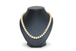 Pearl necklace on black mannequin isolated