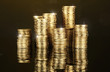 Many coins in columns on dark background