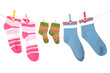 Colorful socks hanging on clothesline, isolated on white