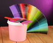 Paint pot, paintbrush and coloured swatches