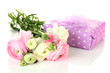 Ranunculus (persian buttercups) and gift, isolated on white