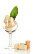 Wineglass and corks isolated on white