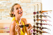 Young woman at optician shopping sunglasses