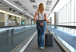 Traveler with a suitcase on the speedwalk
