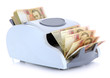 Photo: Machine for counting money with Ukrainian money, isolated Machine for counting money with Ukrainian money, isolated