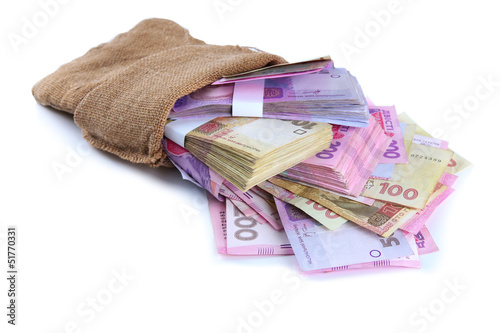 Photo: Burlap bag with Ukrainian money, isolated on white Burlap bag with Ukrainian money, isolated on white