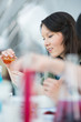 High School students. Pretty female student mixing reagents usin