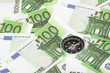 euro bank notes and a compass