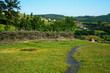 View of stream and hilly landscape in Kosovo