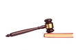 Judge's gavel on red legal book