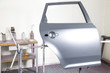 Door to be painted in a car body painter garage