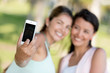 Girls taking a picture with the phone