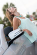 Happy woman with her car