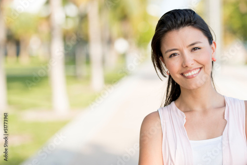 Photo: Woman smiling at the park Woman smiling at the park