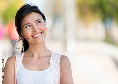 Photo: Thoughtful woman outdoors Thoughtful woman outdoors