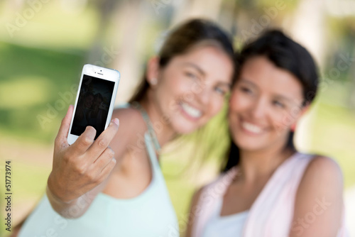 Photo: Girls taking a picture with the phone Girls taking a picture with the phone