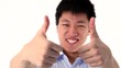 Asian young man showing two thumbs up gesture