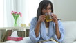Black woman with flu drinking tea